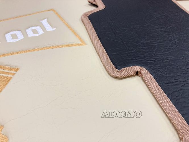 Kunstlederfußmatten mit Sitzsockel für DAF XF 106 ab 07/2017 schwarz - beige - glatt, großes Logo 